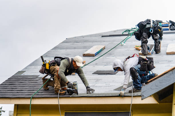 Professional Roofing technician working in Burket, IN